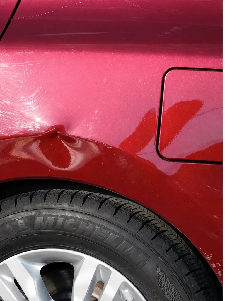 Dent before paintless dent repair